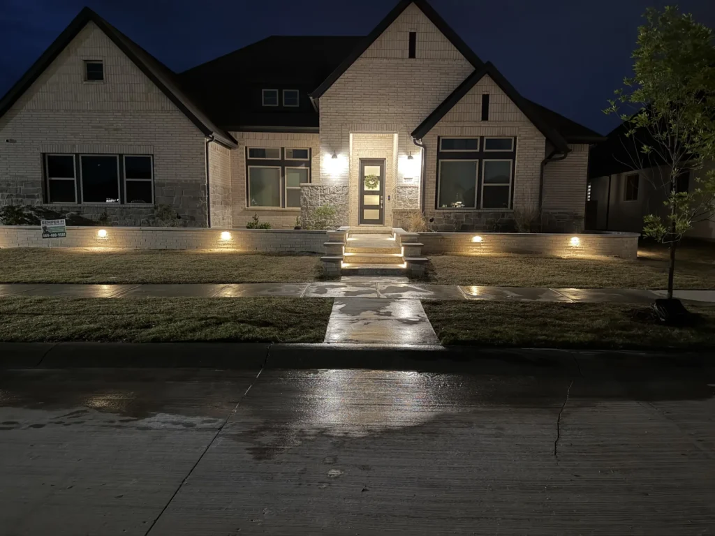 Landscape lighting on the front of a home in Double Oak, TX